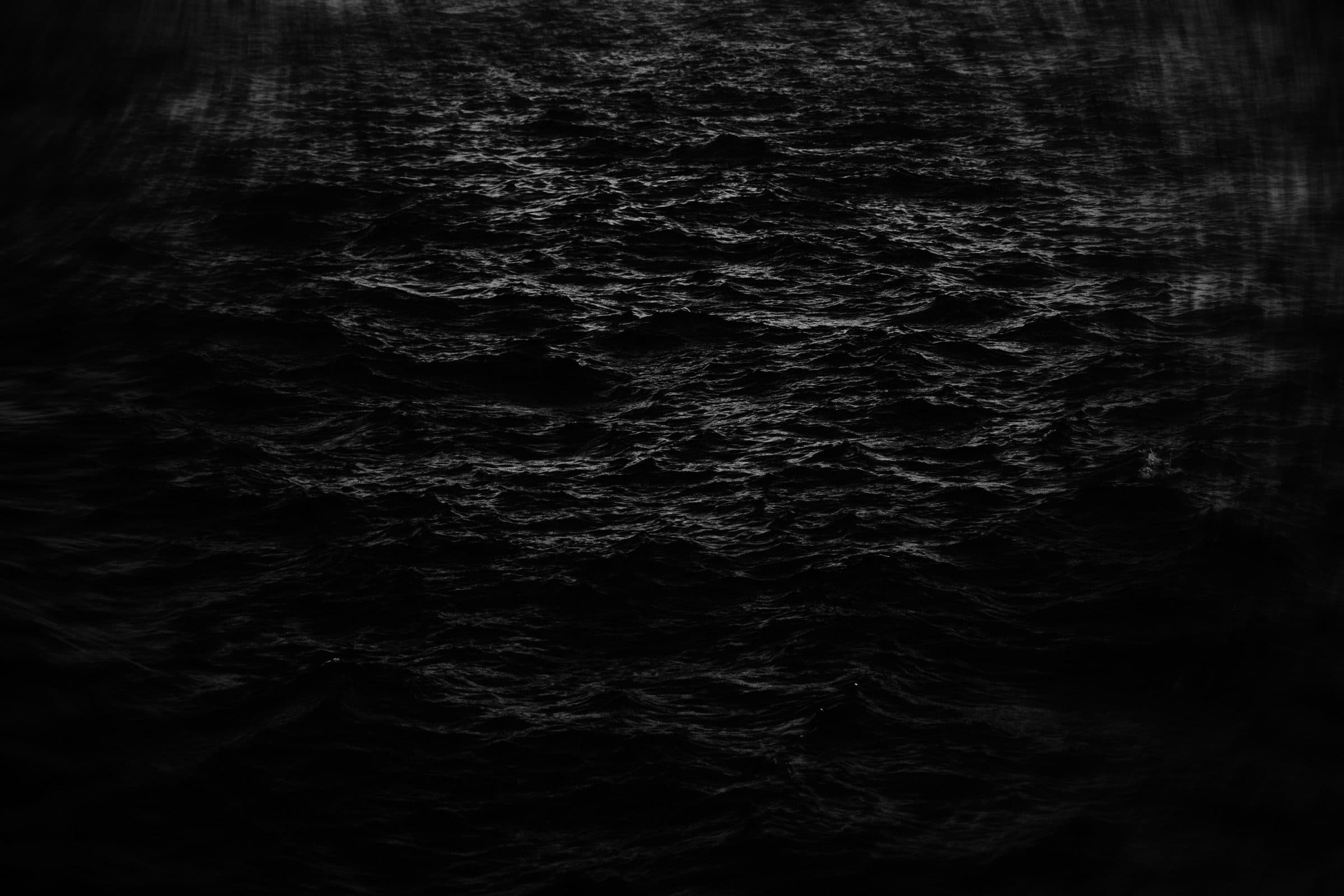 Dark ocean surface at night